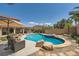 Inviting swimming pool, spa, and patio area complemented by lush landscaping and a well-manicured lawn at 6103 Sundown Crest St, Las Vegas, NV 89113