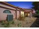 Wide angle view of the backyard showing the covered patio, landscaping, and exterior AC unit at 615 Cervantes Dr, Henderson, NV 89014