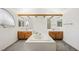 Bright bathroom featuring dual sinks, a tub, and elegant fixtures at 615 Cervantes Dr, Henderson, NV 89014