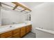 Bathroom featuring a double sink with wood cabinets at 615 Cervantes Dr, Henderson, NV 89014