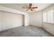 Spacious bedroom with a ceiling fan and natural light from the window at 615 Cervantes Dr, Henderson, NV 89014