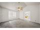 Bright bedroom with a ceiling fan, window seat, and ensuite bathroom access at 615 Cervantes Dr, Henderson, NV 89014
