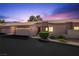 Inviting single-story home featuring a well-manicured lawn, attached garage, and charming curb appeal at 615 Cervantes Dr, Henderson, NV 89014