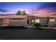 Charming home featuring a two-car garage and manicured front yard with shrubbery at 615 Cervantes Dr, Henderson, NV 89014