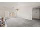 Spacious living room featuring carpet and a sliding glass door at 615 Cervantes Dr, Henderson, NV 89014