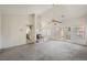 Open-concept living room featuring high ceilings, a fireplace, and carpet at 615 Cervantes Dr, Henderson, NV 89014