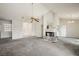 Bright living room showcasing a fireplace, carpet, and natural light at 615 Cervantes Dr, Henderson, NV 89014
