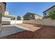This home has a covered patio and low-maintenance backyard with decorative rock at 6241 Overhang Ave, Henderson, NV 89011