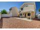 This home has a covered patio and low-maintenance backyard with decorative rock at 6241 Overhang Ave, Henderson, NV 89011