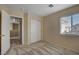 Bedroom offers a window with blinds, closet and carpet at 6241 Overhang Ave, Henderson, NV 89011