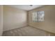 Bedroom offering neutral colored walls, window with blinds and neutral carpet at 6241 Overhang Ave, Henderson, NV 89011