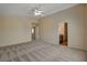 Expansive bedroom with plush carpeting, neutral-colored walls, and access to a private bathroom and closet at 6241 Overhang Ave, Henderson, NV 89011