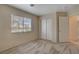 Bedroom featuring neutral colored walls, window and carpet at 6241 Overhang Ave, Henderson, NV 89011