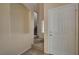 Inviting entryway with neutral walls, leading to a staircase and a view of the upper level, next to a front door at 6241 Overhang Ave, Henderson, NV 89011