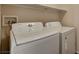 The laundry room features a newer washer and dryer set with storage shelf above at 6241 Overhang Ave, Henderson, NV 89011