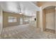 Spacious living room with plush carpet and a ceiling fan at 6241 Overhang Ave, Henderson, NV 89011