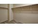 Walk-in closet features carpet and shelves for optimized storage at 6241 Overhang Ave, Henderson, NV 89011