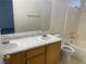 Well-lit bathroom featuring dual sinks and a tub with shower at 6340 Cranberry Ln, Las Vegas, NV 89156