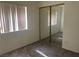 Comfortable bedroom featuring mirrored closet doors and a light-filled window at 6340 Cranberry Ln, Las Vegas, NV 89156