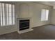 Inviting living room boasting a cozy fireplace, and neutral color palette at 6340 Cranberry Ln, Las Vegas, NV 89156