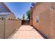 This backyard features a concrete block wall and tile flooring at 6358 Meadow Lark Ln, Las Vegas, NV 89103