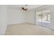 Spacious bedroom with tile flooring and sliding door access to the backyard at 6358 Meadow Lark Ln, Las Vegas, NV 89103