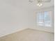 Bedroom with a ceiling fan, neutral paint and a large window at 6358 Meadow Lark Ln, Las Vegas, NV 89103