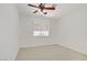 Well-lit bedroom featuring a ceiling fan, neutral paint, and a large window at 6358 Meadow Lark Ln, Las Vegas, NV 89103