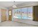 Bright dining area with views of the pool, tiled floors and natural light at 6358 Meadow Lark Ln, Las Vegas, NV 89103