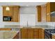 Modern kitchen boasting granite countertops, stainless steel appliances, and ample cabinet space at 6358 Meadow Lark Ln, Las Vegas, NV 89103