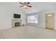 Bright living room featuring tiled floors, a decorative fireplace, and a large window at 6358 Meadow Lark Ln, Las Vegas, NV 89103