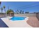 Backyard pool area with desert landscaping and palm trees at 6358 Meadow Lark Ln, Las Vegas, NV 89103