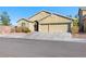 Charming single-story home featuring a two-car garage and a well-maintained front yard at 6360 Bullring Ln, Las Vegas, NV 89130