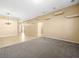 Spacious living room featuring carpeted floors and decorative wall alcoves at 6360 Bullring Ln, Las Vegas, NV 89130
