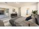 Serene main bedroom with sliding glass doors, neutral tones, and stylish furniture at 6360 Bullring Ln, Las Vegas, NV 89130