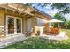 Charming backyard with a covered patio, lounge chair, and outdoor dining set, ideal for relaxation at 6810 Silver Crescent St, Las Vegas, NV 89148