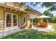 Charming backyard with a covered patio, outdoor dining area, and lush greenery for relaxing and entertaining at 6810 Silver Crescent St, Las Vegas, NV 89148