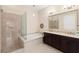 Primary bathroom with dual vanity, bathtub, and separate glass-enclosed shower at 6810 Silver Crescent St, Las Vegas, NV 89148