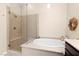 Spa-like bathroom featuring a glass shower, soaking tub, and elegant tile work at 6810 Silver Crescent St, Las Vegas, NV 89148