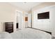 Bedroom features a decorative ceiling light, accent wall, and access to additional rooms at 6810 Silver Crescent St, Las Vegas, NV 89148