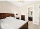 Bedroom features a decorative ceiling light and ensuite access to bathroom at 6810 Silver Crescent St, Las Vegas, NV 89148