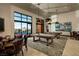 Spacious game room featuring pool tables, comfortable seating, and stylish decor, perfect for entertaining and relaxation at 6810 Silver Crescent St, Las Vegas, NV 89148