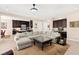 Bright and open living area next to kitchen featuring a large sectional sofa at 6810 Silver Crescent St, Las Vegas, NV 89148