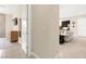 Open-concept living room featuring neutral tones, tile flooring, and seamless flow into the kitchen at 6810 Silver Crescent St, Las Vegas, NV 89148