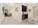 Spacious living area with wet bar, tile flooring, and cozy seating at 6810 Silver Crescent St, Las Vegas, NV 89148