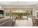 Open living space features expansive windows and a seamless connection to the outdoor patio area at 6810 Silver Crescent St, Las Vegas, NV 89148
