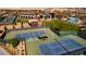 Aerial view of well-maintained community tennis courts and landscaping at 6810 Silver Crescent St, Las Vegas, NV 89148