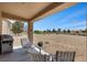 Covered patio overlooking a well-maintained backyard and desert landscape at 7817 Homing Pigeon St, North Las Vegas, NV 89084