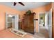 Spacious bedroom featuring a large armoire and bathroom access at 7817 Homing Pigeon St, North Las Vegas, NV 89084