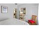 Well lit bedroom with white walls and closet doors at 7817 Homing Pigeon St, North Las Vegas, NV 89084